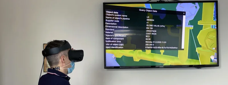 Person wearing a VR headset viewing a screen with detailed object data for a globe valve, including dimensions, material, and specifications