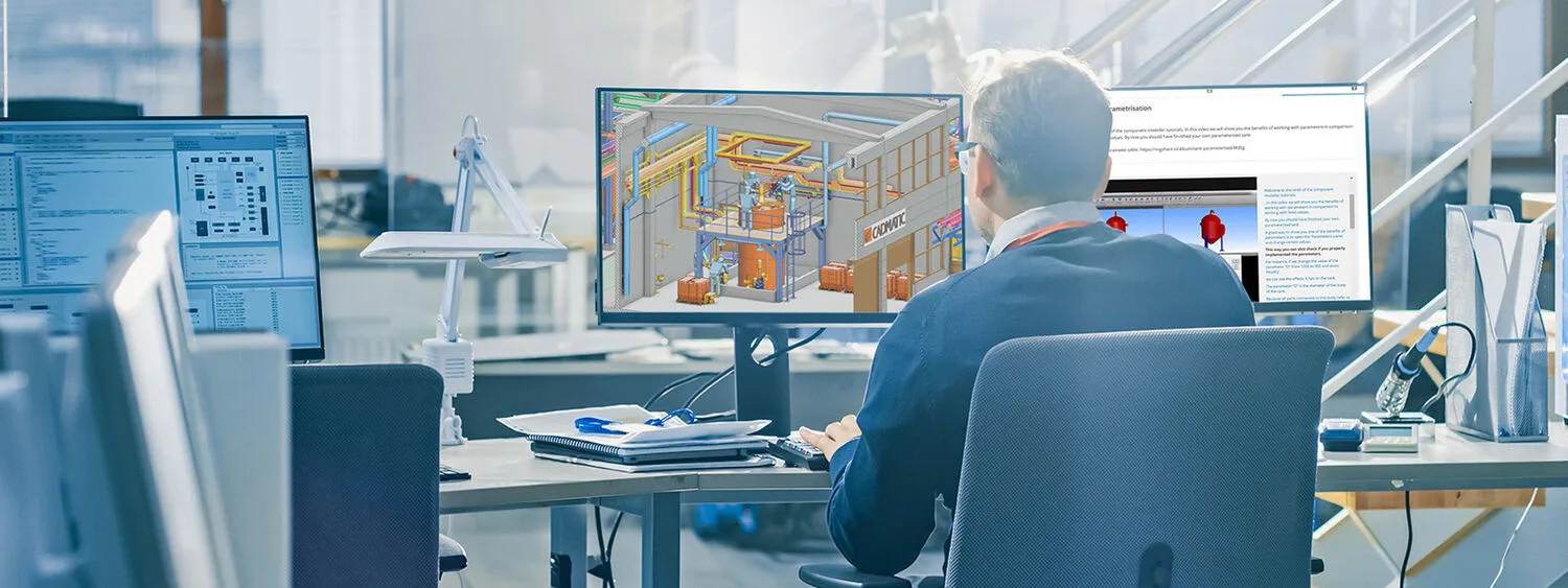 Engineer working with Cadmatic 3D CAD software in an office