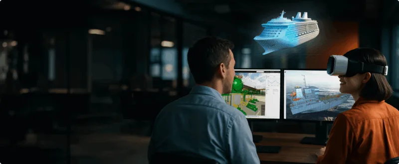 Man and woman in front of computer screens.