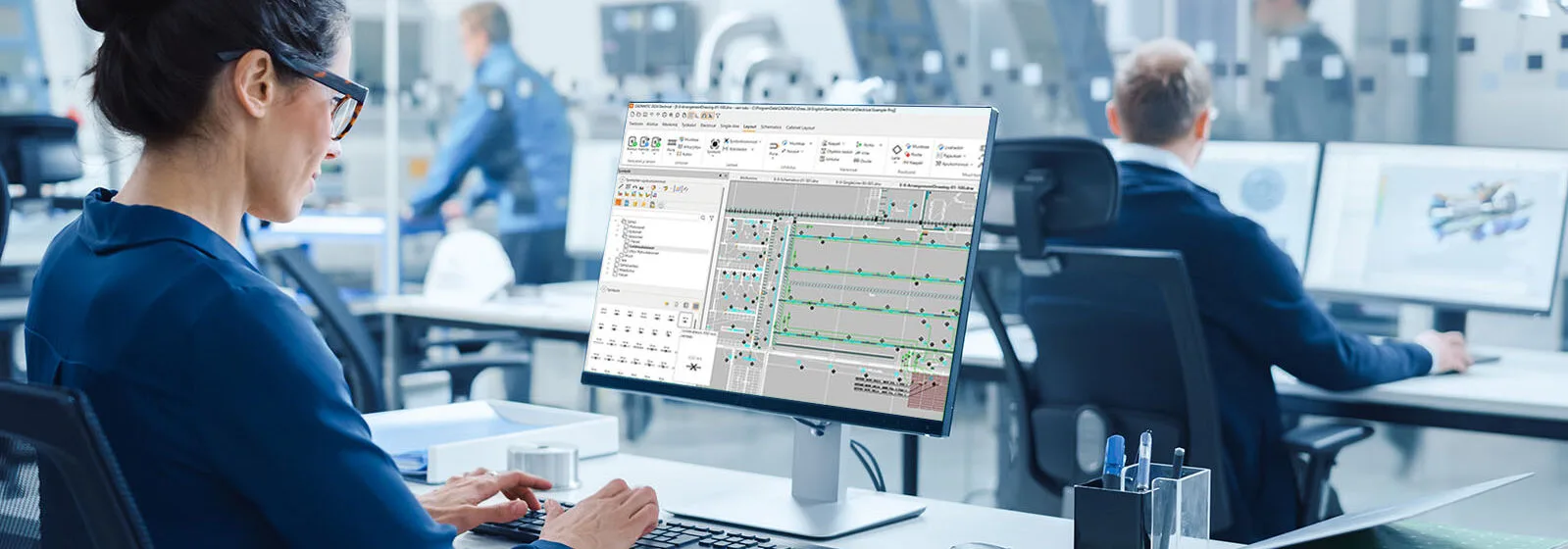 Engineer is working with CADMATIC Electrical on a computer screen