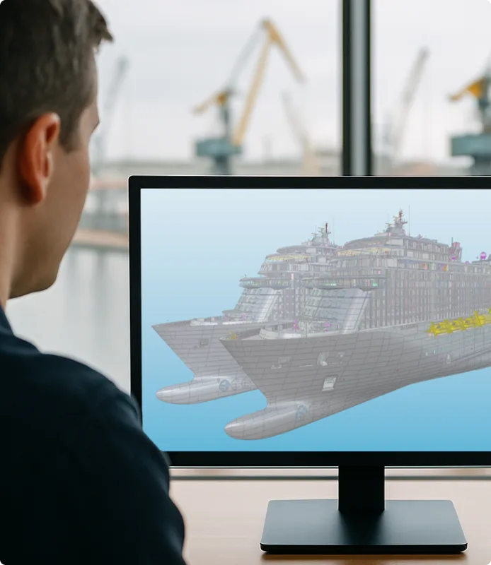 Mies tarkastelee sisaralusten 3D-malleja tietokoneen näytöllä. Sisaralusten hallinta on Cadmaticin 3D-varustussuunnitteluohjelmiston keskeinen ominaisuus.