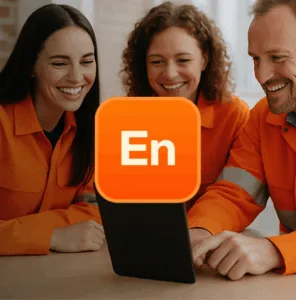 Three engineers sitting in an industrial office checking data on tablet.
