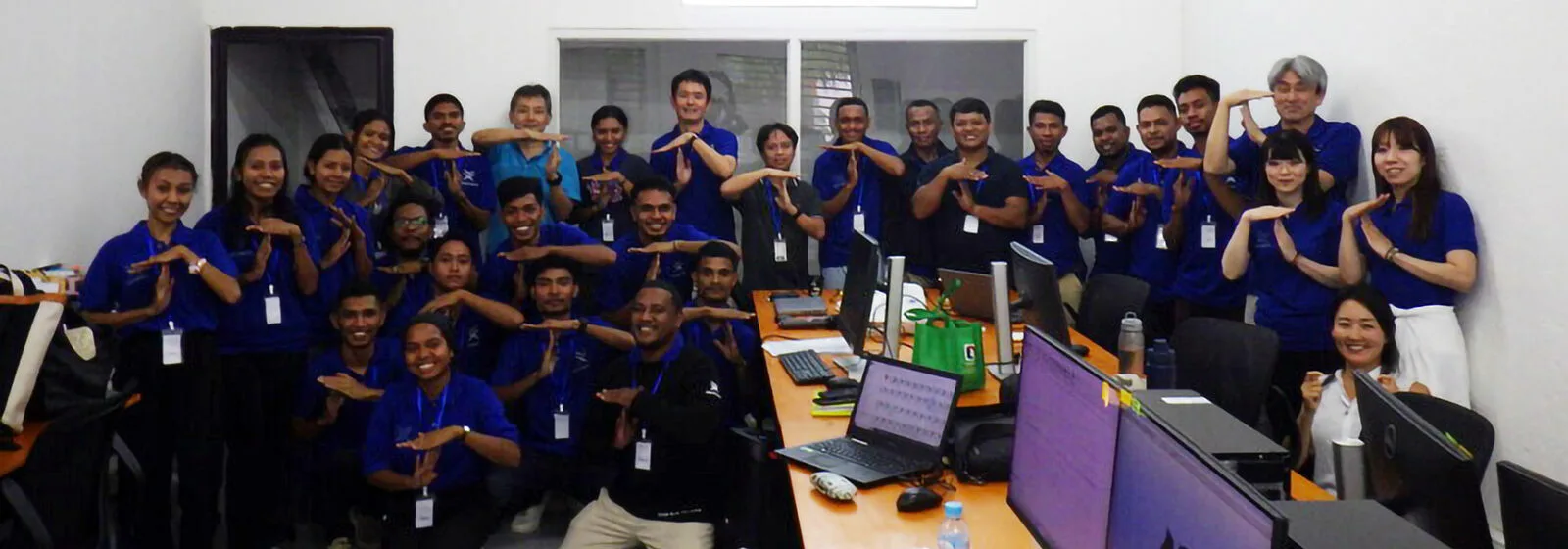 Tsuneishi Shipbuilding team in their office