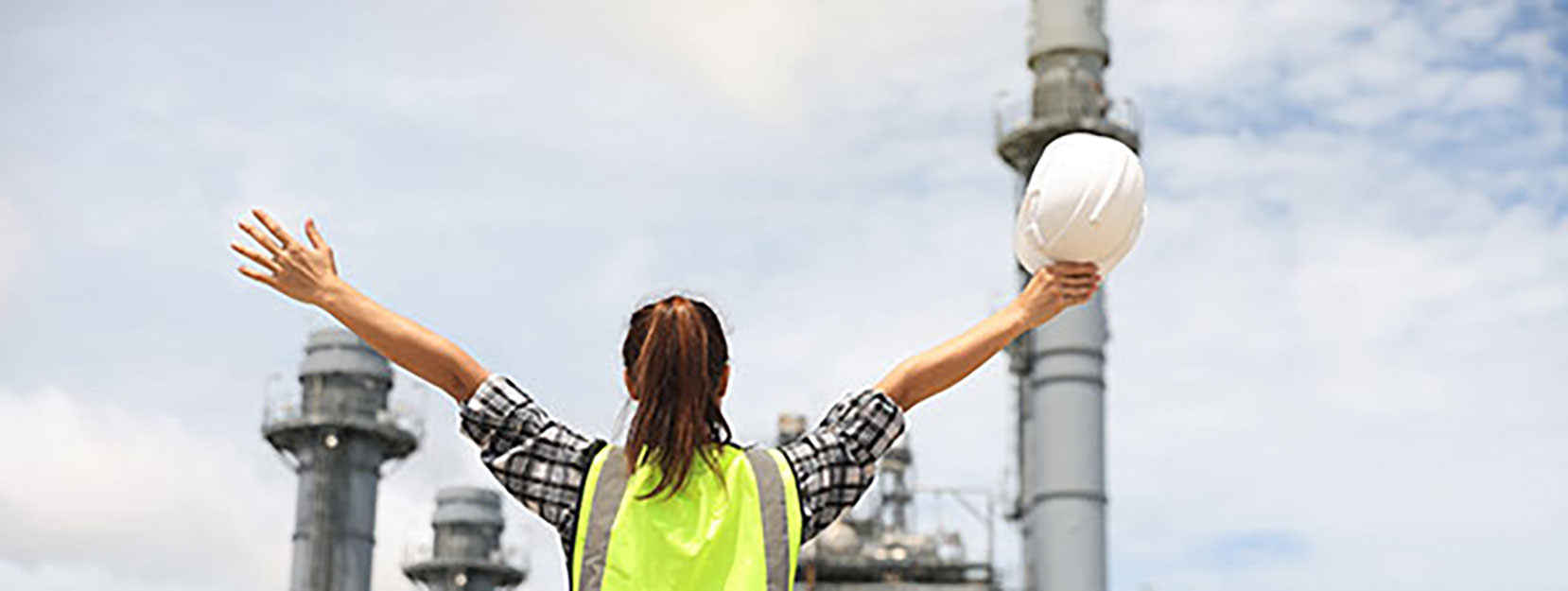 Plant industry and engineer with a helmet in his hand