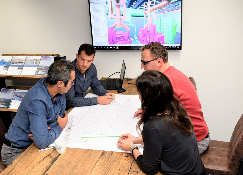 DEKC Maritime team members using CADMATIC eBrowser in a design review meeting