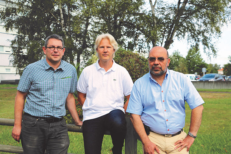 Vincent Doucet, Laurent Debû, and Hédi Bessibes outside of the office