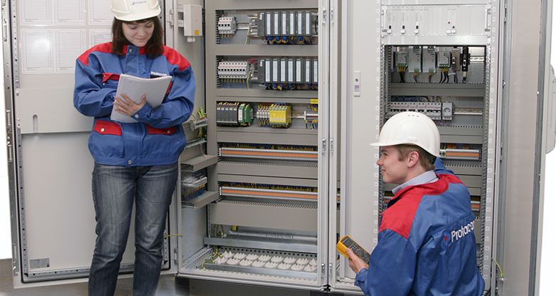 Boy and girl in front of the electrical cabinet