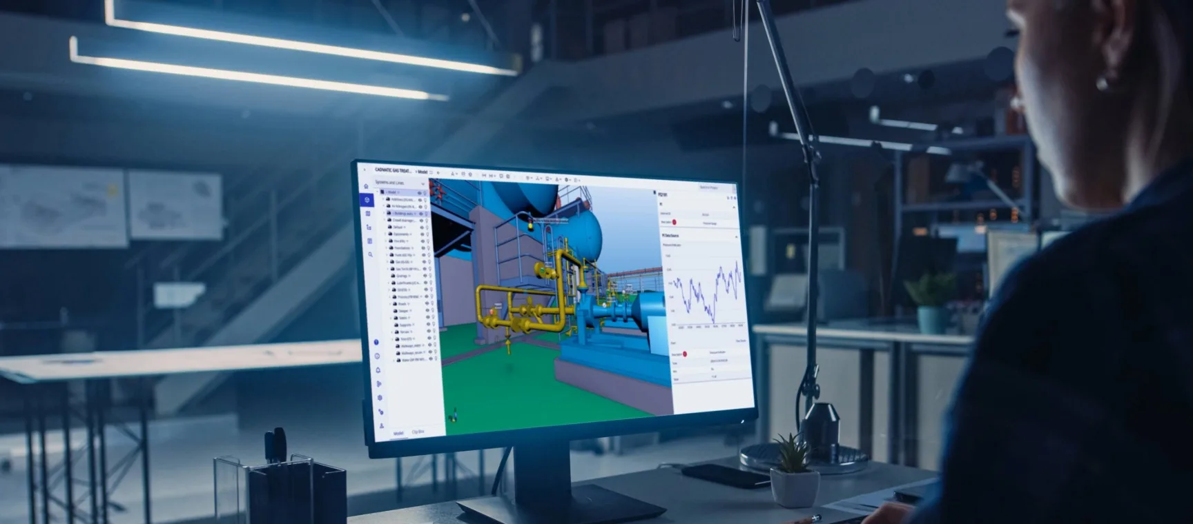 Engineer looking at a digital twin on computer.