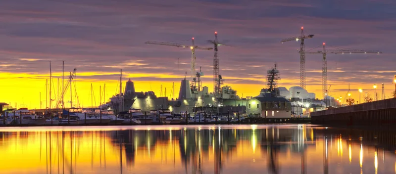 Norfolk, Virginia, USA shipyard on the Chesapeake at golden hour